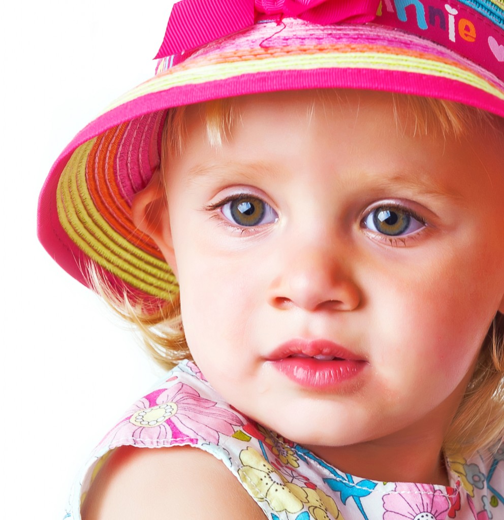 Toddler in a colourful hat