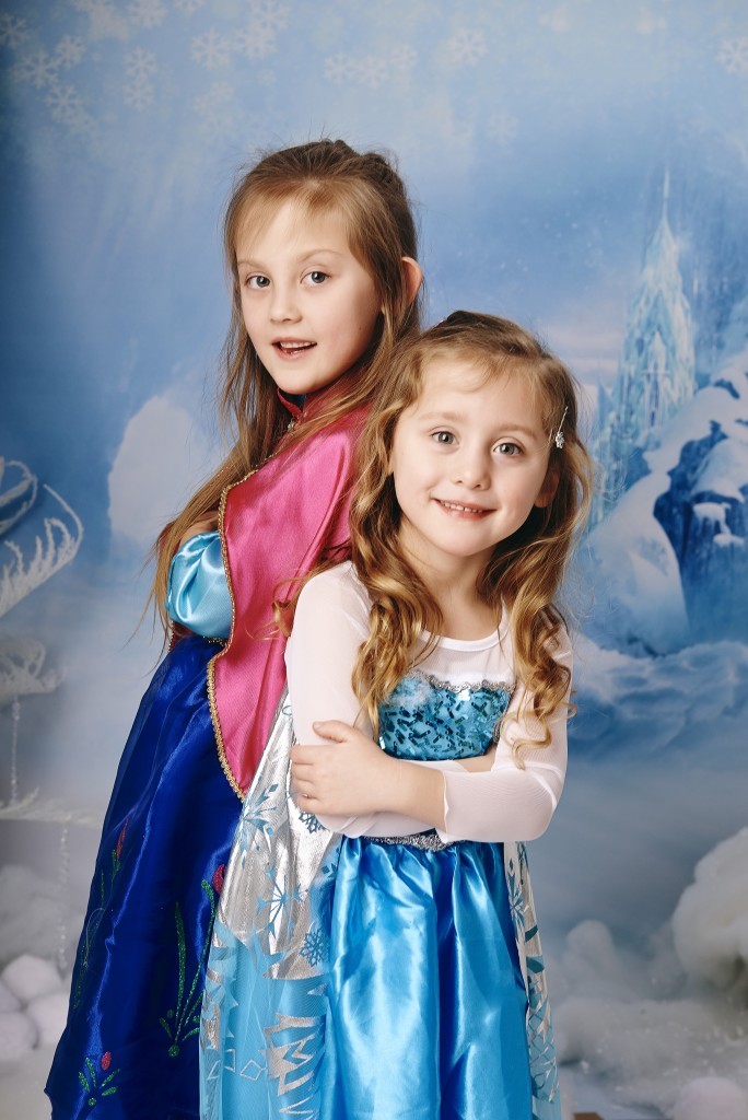 Two sisters pose as Anna and Elsa from Frozen