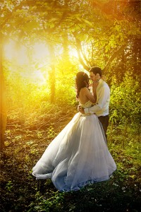 A bride and groom in woodland